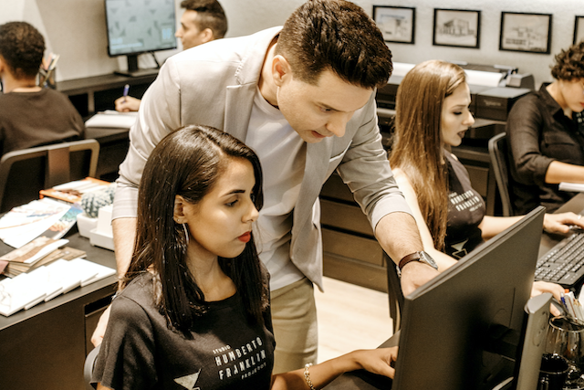 Trainer helping female student - small copy